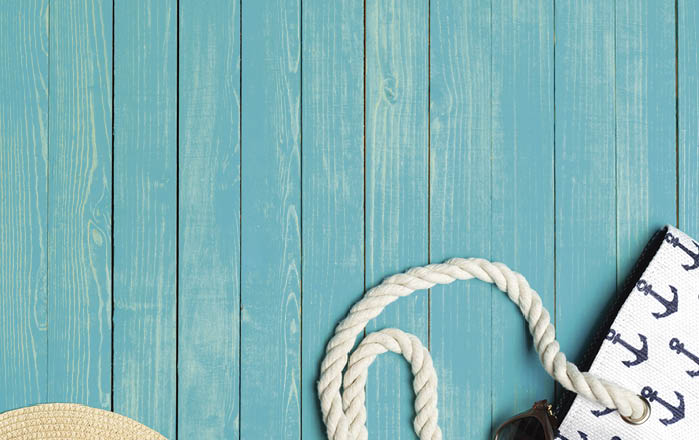 Beach accessories on wooden table.