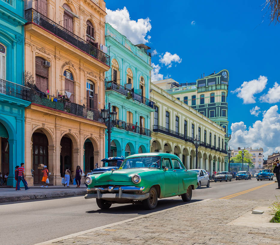 Cityscape with american green vintage car on the main street in Havana City Cuba - Serie Cuba Reportage