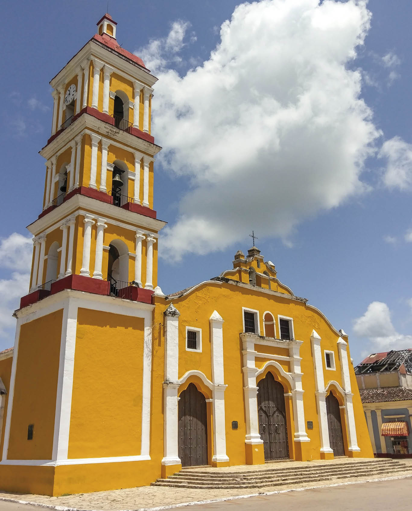Yellow colonial style church of Iglesia Major in the city of Remedios, Cuba